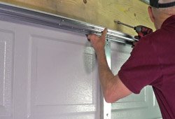 replace garage door remove old install new