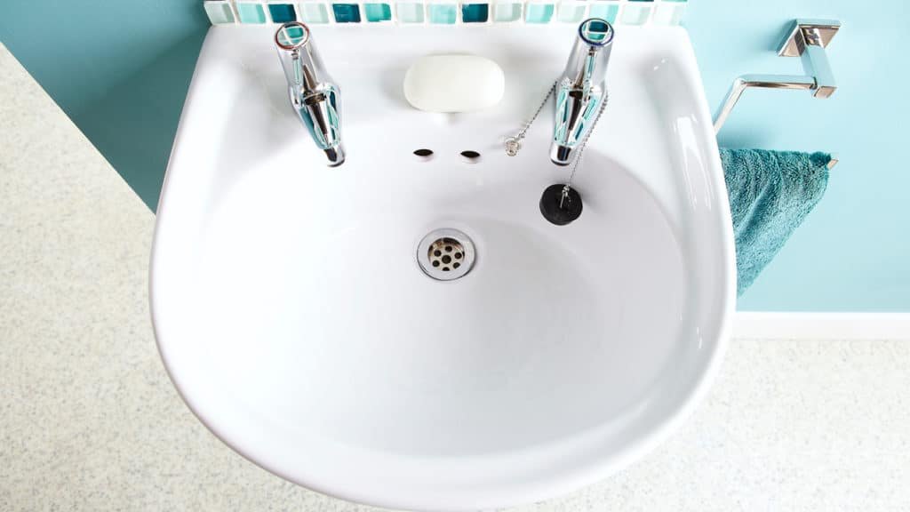 clean bathroom sink remove stains soap scum