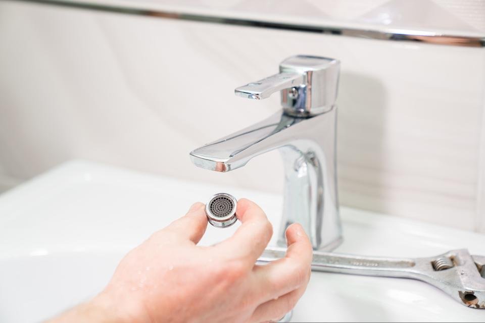 clean faucet aerator remove buildup restore water