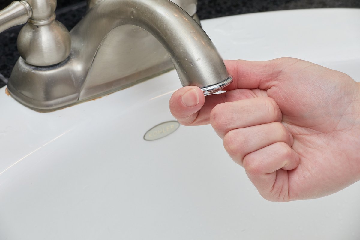 clean faucet aerator remove buildup restore water 2