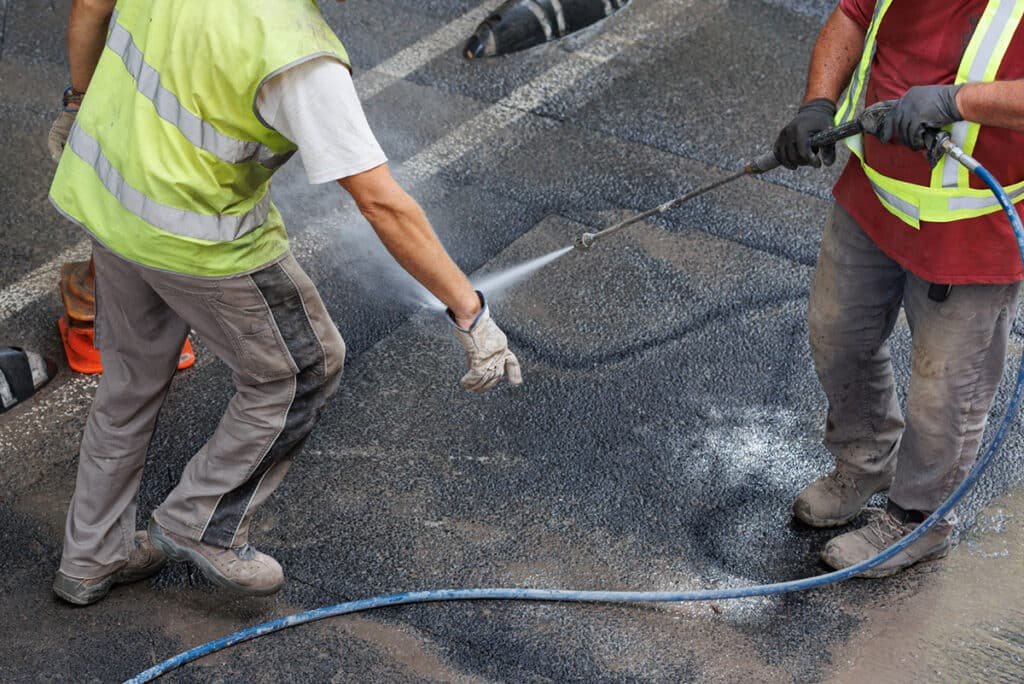 clean asphalt remove oil stains moss grime 2