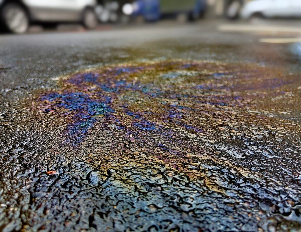 clean asphalt remove oil stains moss grime